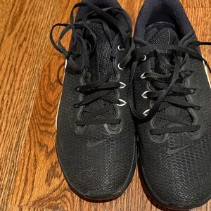 Black Nike Athletic Sneakers with Silver Accents